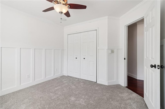4046 Water Hole Ct, Douglasville, GA 30135 - unfurnished bedroom featuring a decorative wall, carpet flooring, ornamental molding, a wainscoted wall, and a closet