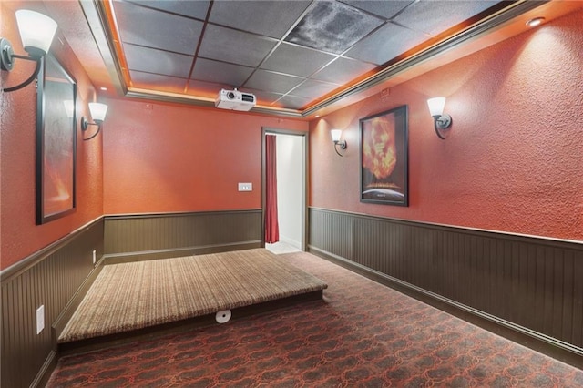 4046 Water Hole Ct, Douglasville, GA 30135 - home theater room with a wainscoted wall, a drop ceiling, and a textured wall