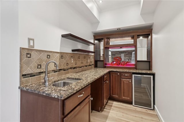 4046 Water Hole Ct, Douglasville, GA 30135 - indoor wet bar with beverage cooler, backsplash, light wood finished floors, and ornamental molding