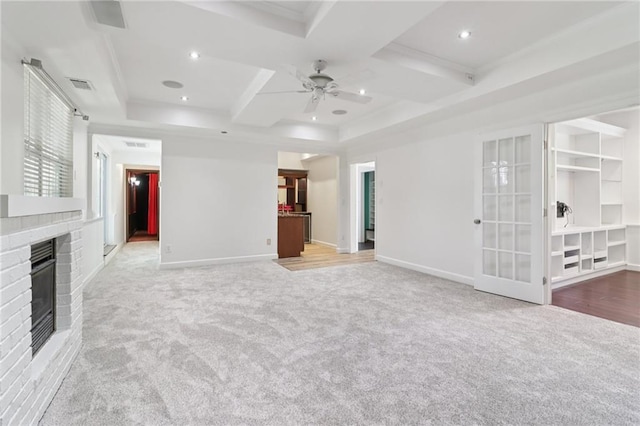 4046 Water Hole Ct, Douglasville, GA 30135 - unfurnished living room with carpet flooring, a fireplace, ceiling fan, ornamental molding, and coffered ceiling