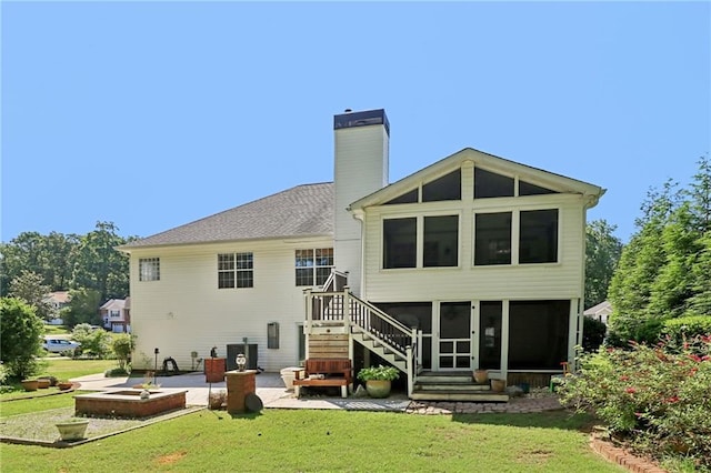 4046 Water Hole Ct, Douglasville, GA 30135 - rear view of house with a sunroom, a chimney, and a yard
