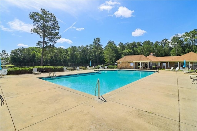 4046 Water Hole Ct, Douglasville, GA 30135 - community pool featuring a patio area and view of scattered trees