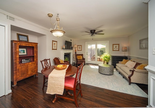 1261 Lavista Rd Unit N4, Atlanta, GA 30324 - dining room with a fireplace, ornamental molding, dark wood-style flooring, and ceiling fan