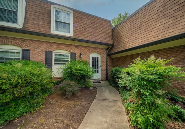 1261 Lavista Rd Unit N4, Atlanta, GA 30324 - entrance to property with mansard roof, a shingled roof, and brick siding
