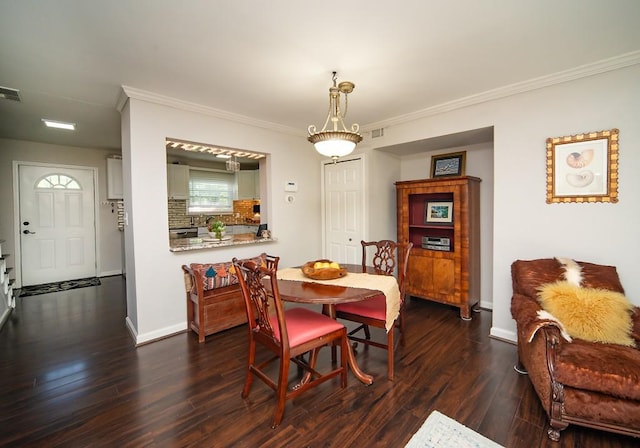 1261 Lavista Rd Unit N4, Atlanta, GA 30324 - dining space featuring ornamental molding, dark wood-style floors, and baseboards