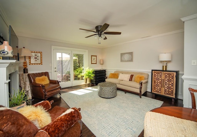 1261 Lavista Rd Unit N4, Atlanta, GA 30324 - living room featuring ornamental molding, dark wood finished floors, ceiling fan, a fireplace, and a wainscoted wall