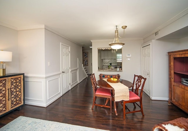 1261 Lavista Rd Unit N4, Atlanta, GA 30324 - dining area with dark wood-type flooring, crown molding, and stairs
