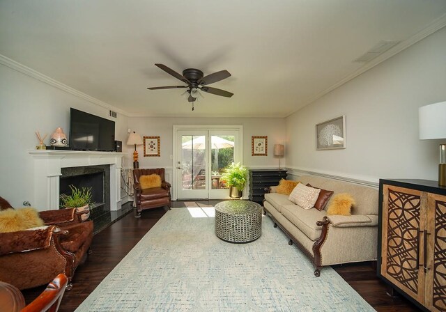 1261 Lavista Rd Unit N4, Atlanta, GA 30324 - living area featuring dark wood finished floors, ceiling fan, a fireplace, and ornamental molding