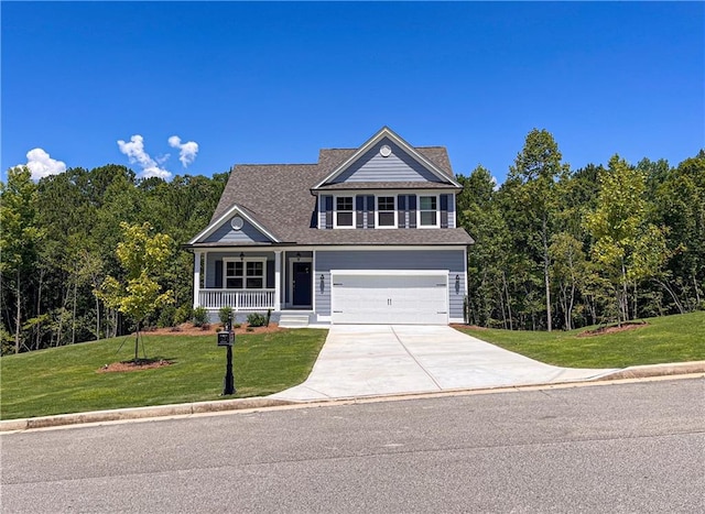 view of front of property with a garage and a front yard