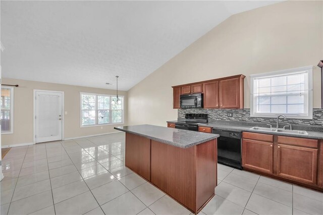 70 Prince Edward Way, Covington, GA 30016 - kitchen with black appliances, decorative backsplash, a center island, light tile patterned floors, and high vaulted ceiling