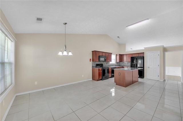70 Prince Edward Way, Covington, GA 30016 - kitchen featuring black appliances, lofted ceiling, a chandelier, light tile patterned floors, and decorative backsplash