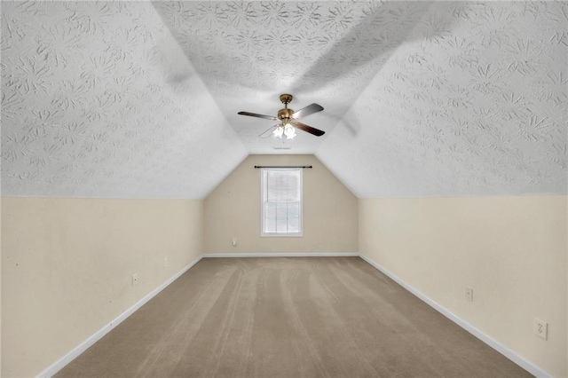 70 Prince Edward Way, Covington, GA 30016 - bonus room with a textured ceiling, lofted ceiling, ceiling fan, and carpet flooring