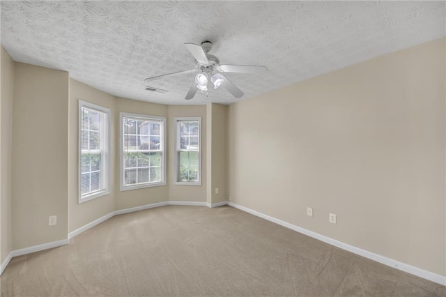 70 Prince Edward Way, Covington, GA 30016 - empty room with carpet floors, ceiling fan, and a textured ceiling