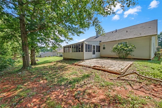 70 Prince Edward Way, Covington, GA 30016 - back of house with a sunroom and a patio area