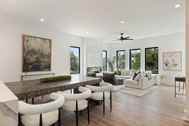 dining space featuring recessed lighting and light wood-style floors