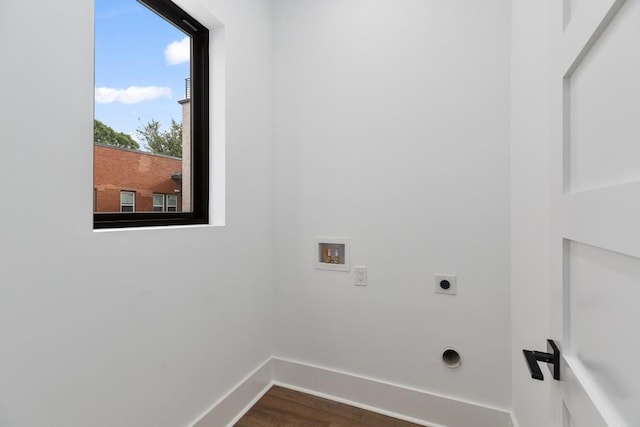 laundry room featuring laundry area, dark wood-style flooring, baseboards, washer hookup, and hookup for an electric dryer