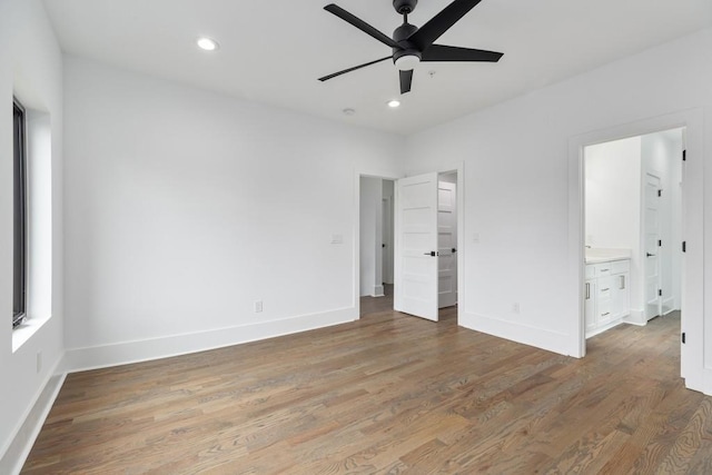 unfurnished bedroom featuring recessed lighting, baseboards, and light wood finished floors