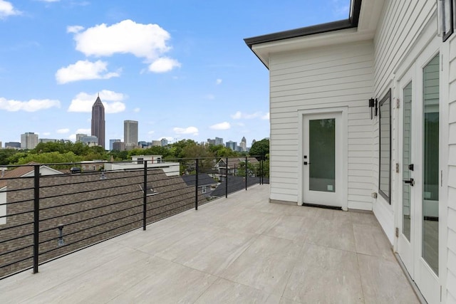 view of patio with a city view and a balcony