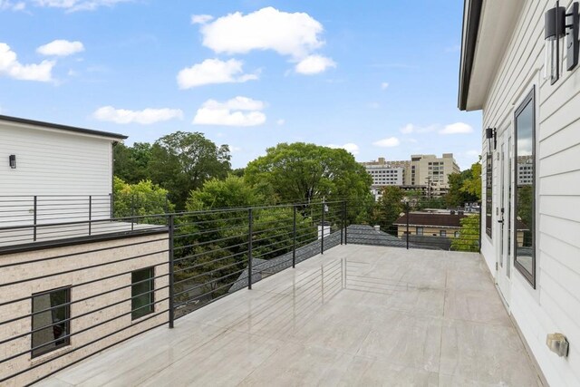 view of patio featuring a balcony