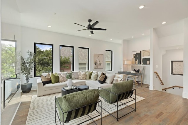 living area with ceiling fan, recessed lighting, wood finished floors, and a wealth of natural light