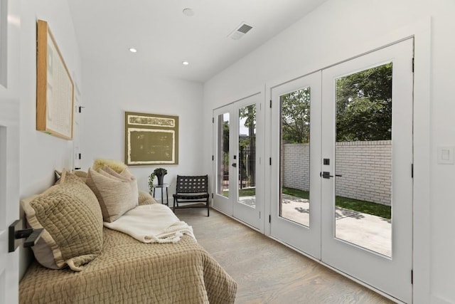 doorway to outside with french doors, recessed lighting, visible vents, and light wood-type flooring