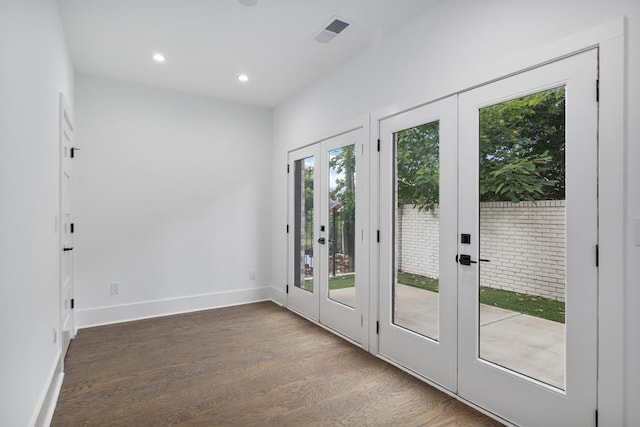 doorway with french doors, visible vents, wood finished floors, baseboards, and recessed lighting