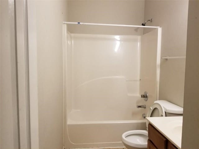 bathroom featuring vanity, toilet, and bathtub / shower combination