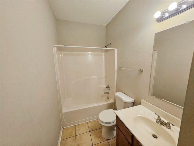 bathroom featuring tile patterned floors, toilet, vanity, and shower / bathing tub combination