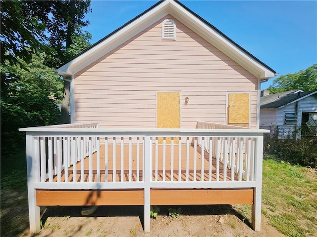 rear view of property featuring a deck