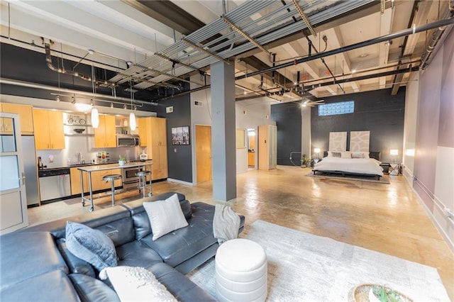 interior space featuring a sink and baseboards