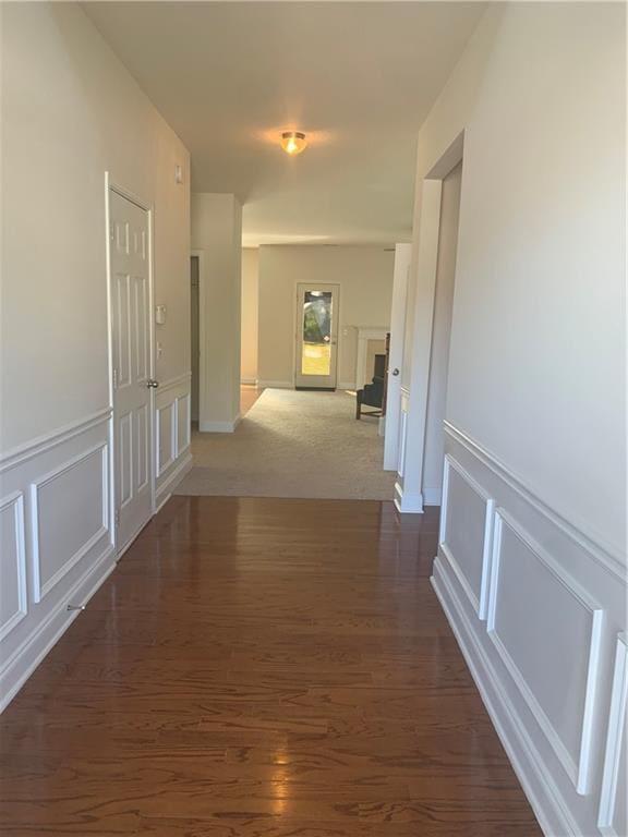 hallway featuring dark wood-type flooring