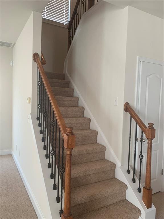 stairway with carpet floors