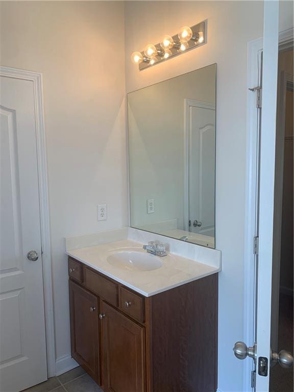 bathroom with tile patterned flooring and vanity