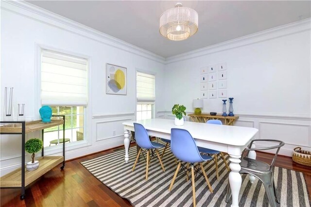 dining area featuring crown molding and dark hardwood / wood-style floors