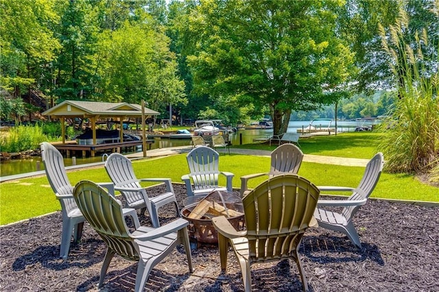 view of patio / terrace featuring a water view and an outdoor fire pit