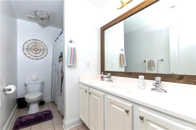 bathroom with tile patterned floors, a shower with curtain, vanity, and toilet