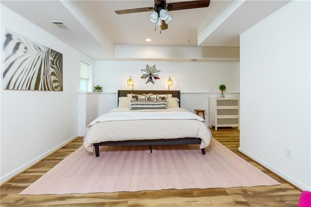 bedroom featuring ceiling fan and wood-type flooring