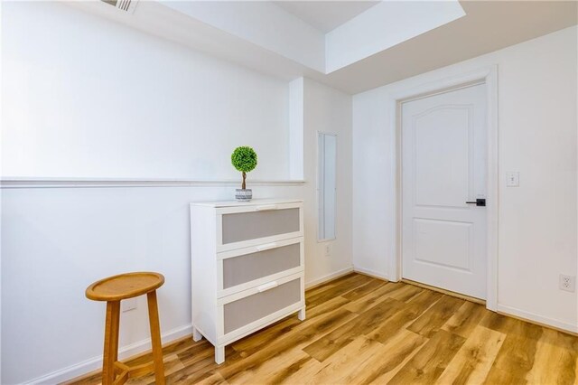 hall with light hardwood / wood-style flooring