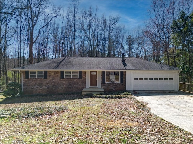 ranch-style house featuring concrete driveway, brick siding, and an attached garage