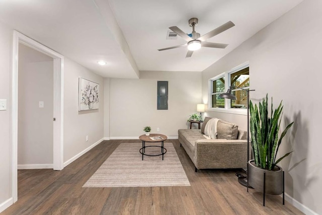 empty room with visible vents, ceiling fan, baseboards, and wood finished floors