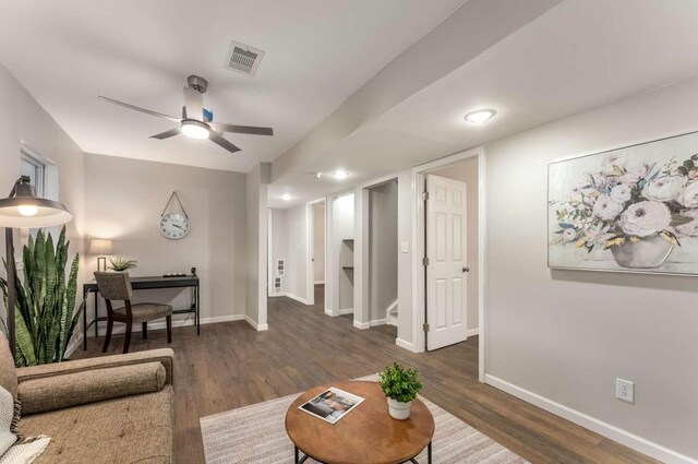 unfurnished bedroom featuring ceiling fan, a closet, wood finished floors, and baseboards