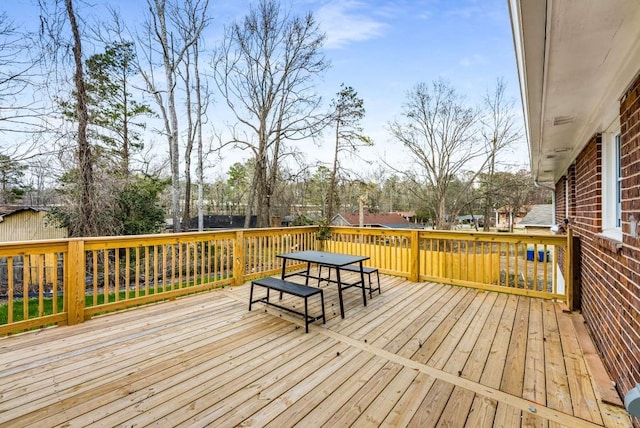 deck with outdoor dining area