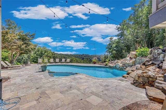 outdoor pool featuring a patio