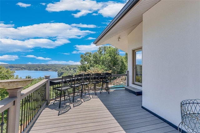 wooden deck with a water view