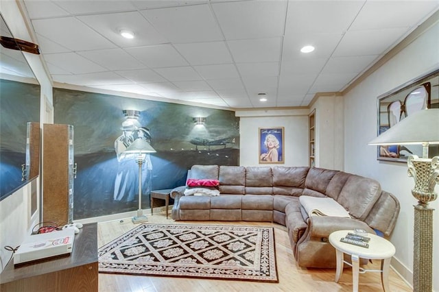 living room featuring baseboards, wood finished floors, and recessed lighting