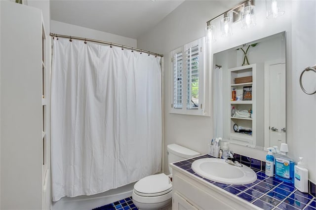 full bath with toilet, vanity, and shower / bath combo with shower curtain