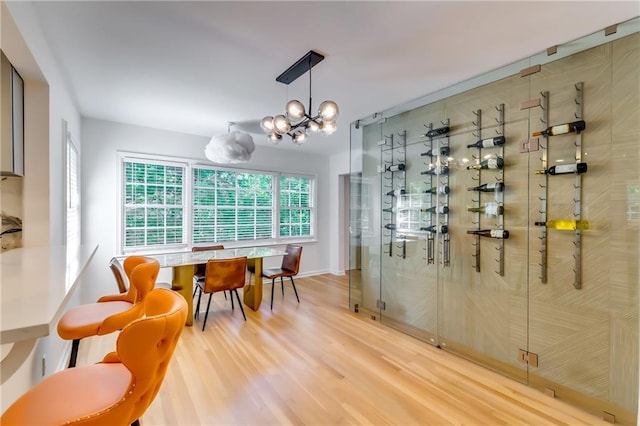 wine cellar with an inviting chandelier and hardwood / wood-style flooring