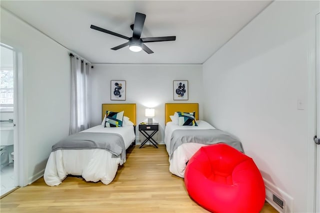 bedroom with hardwood / wood-style flooring and ceiling fan