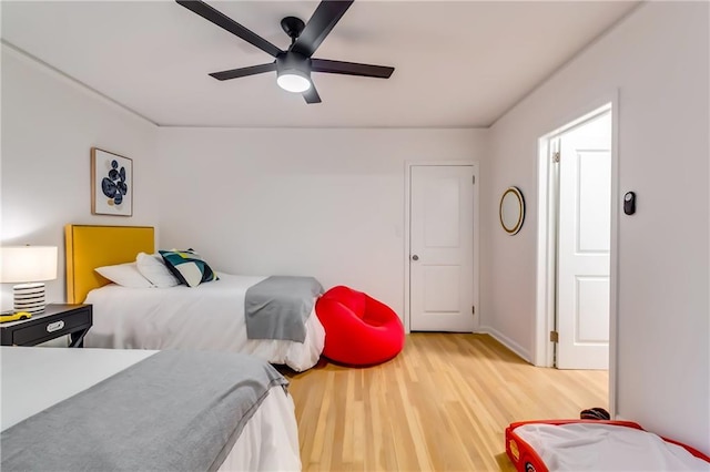 bedroom featuring wood-type flooring and ceiling fan