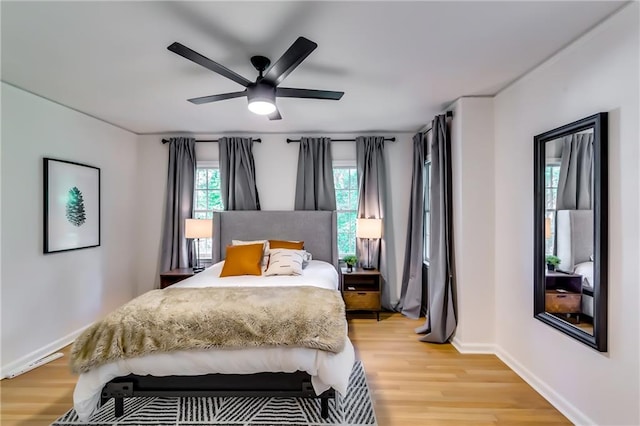 bedroom featuring ceiling fan and light hardwood / wood-style flooring